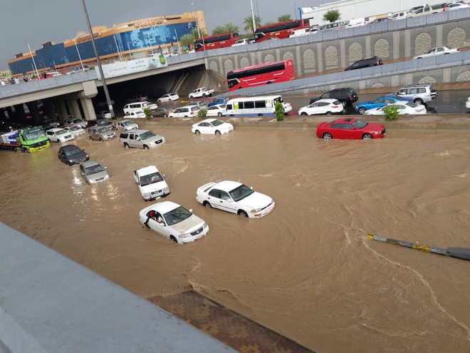 Dozens rescued from flooding as heavy rain shuts schools and roads in ...